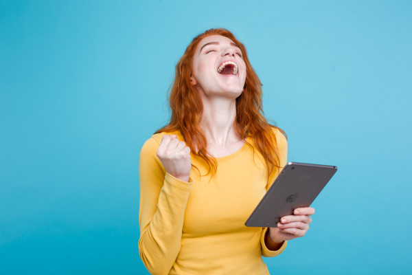Young happy woman with tablet 
